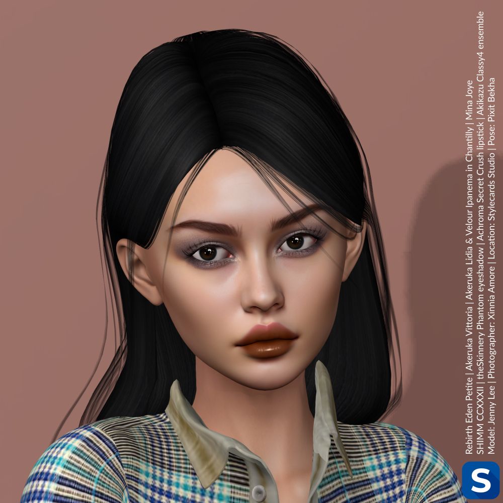 A headshot of Jenny Lee in front of a beige backdrop. She has long black hair, brown eyes and is wearing a plaid shirt. Her lipstick is glossy the color of milk chocolate while her eyeshadow is smoky and subtle.