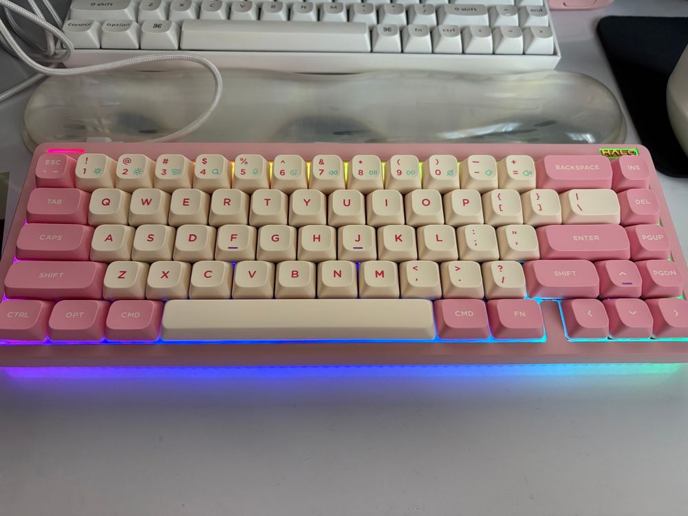 Pink and white NuPhy Halo65 v2 keyboard with colorful glowing lights