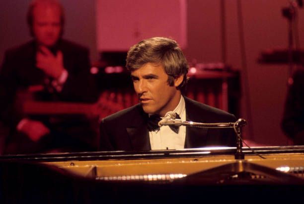 Bacharach in a tuxedo, at the piano
