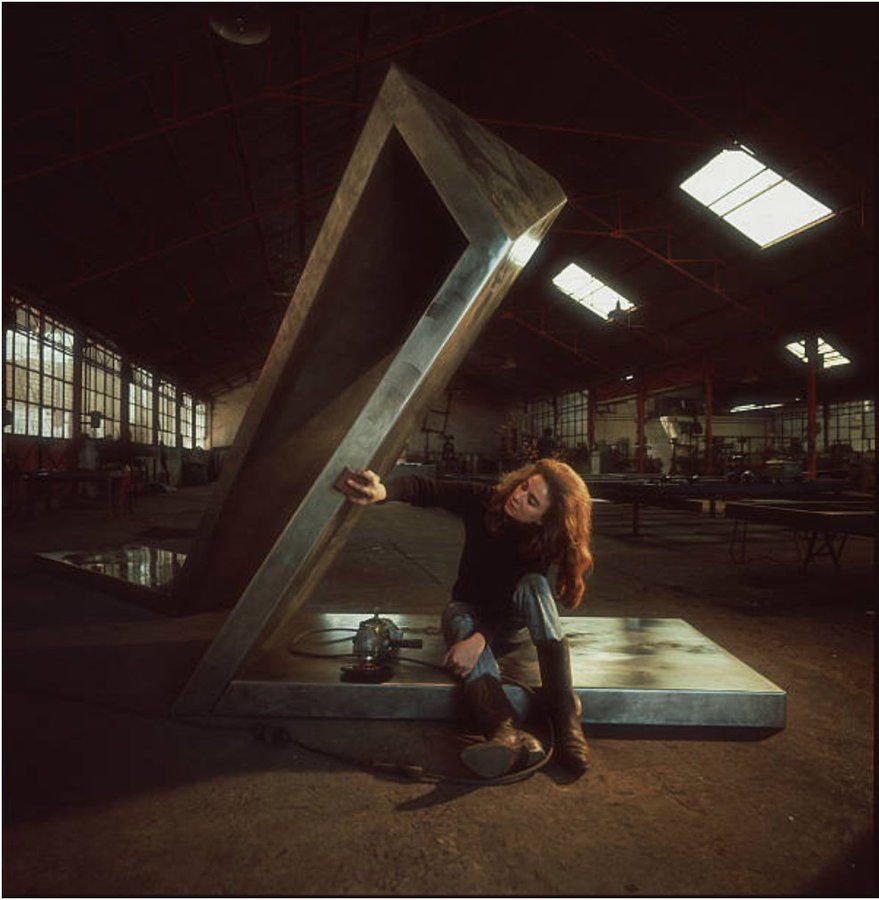 Pepper in his studio with one of her large steel sculptures