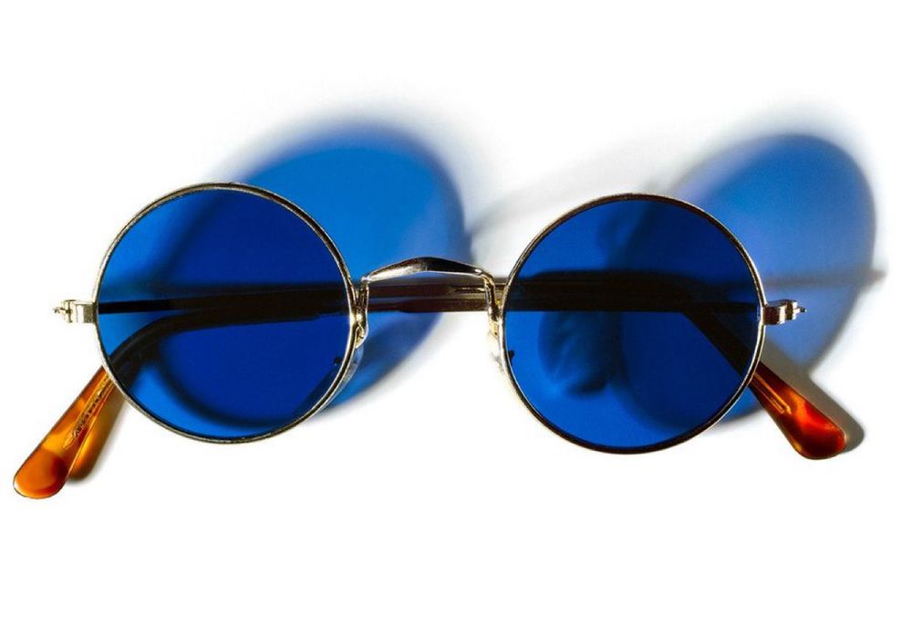 A pair of eyeglasses with round blue-tinted lenses