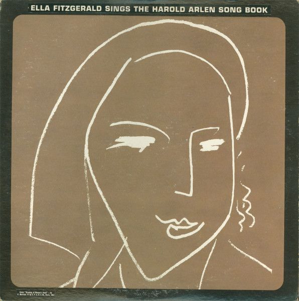 A sketch of Ella’s face; white on a brown background. 
