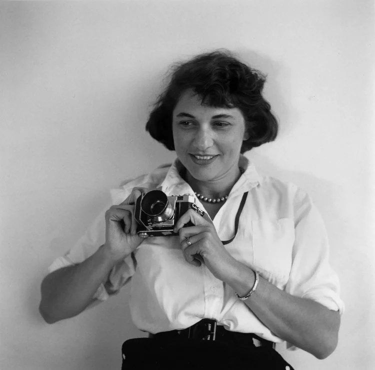 Orkin with her camera around her neck