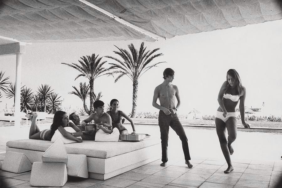 Description: Luis and Alvaro Figuerroa with friends on the terrace of their home in Marbella, Spain.