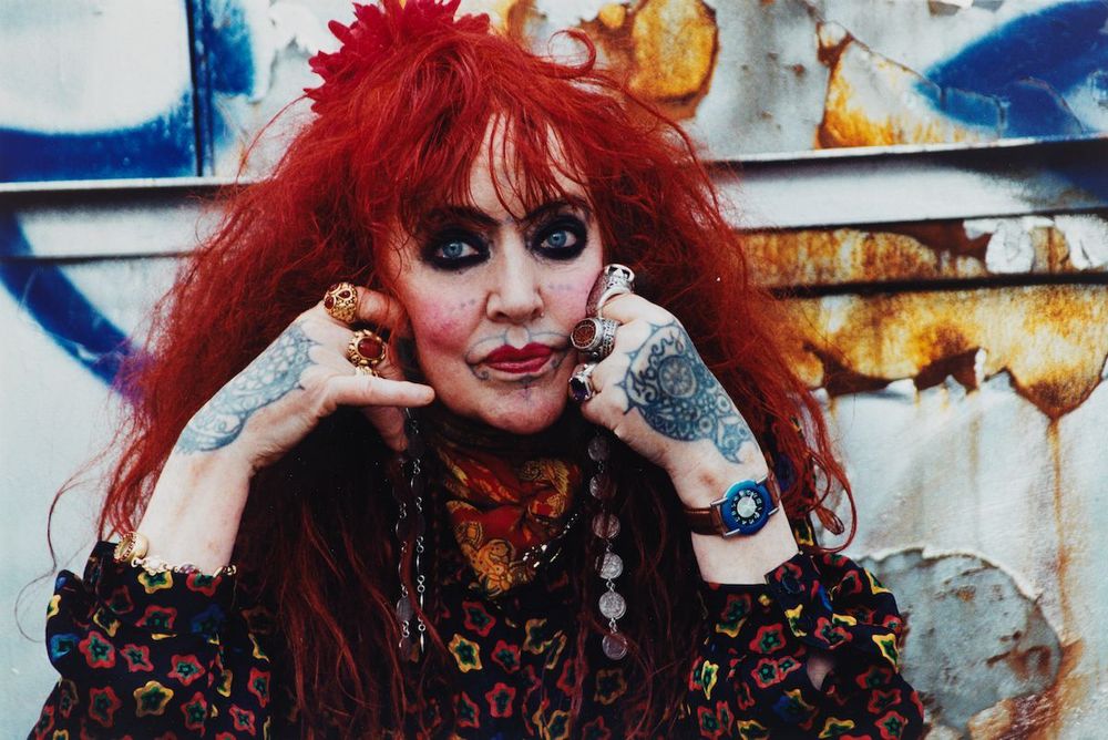 The older Myers, with the same red hair, dark eye makeup, & tattoos.