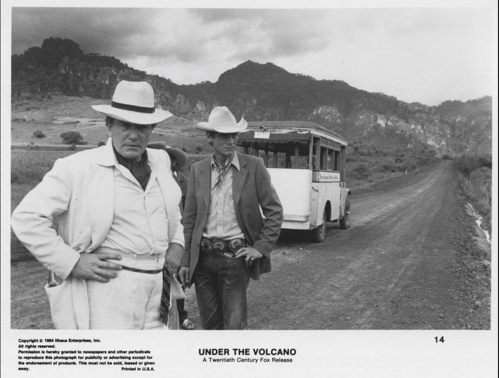 Andrews & Finney wearing white hats, in front of a bus on a Mexican road