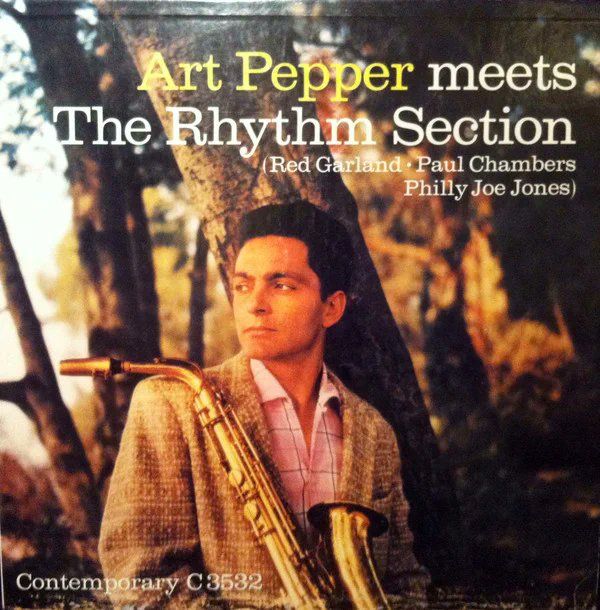 Pepper with his saxophone, looking cool in a forest