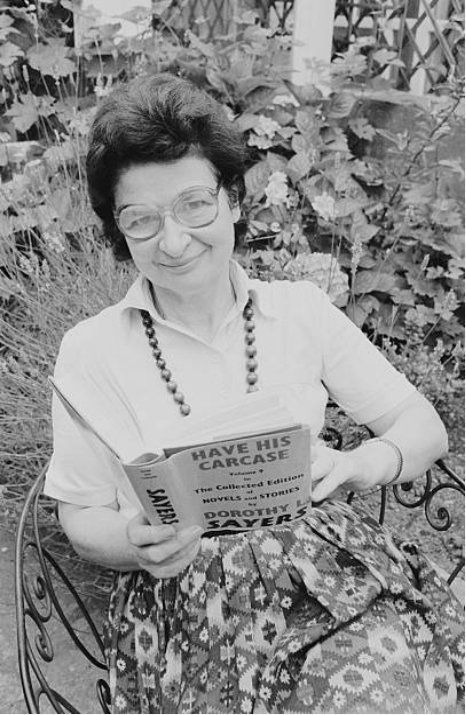 James sits in her garden & reads the mystery