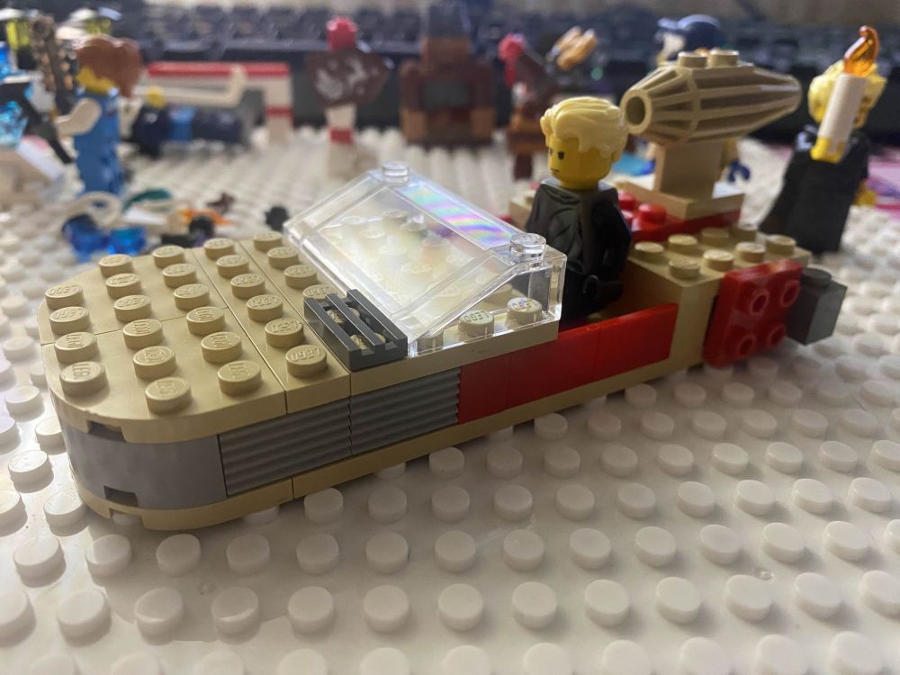 Endor Luke inside of a 1999 Tatooine Landspeeder. Christmas Legos in the background.