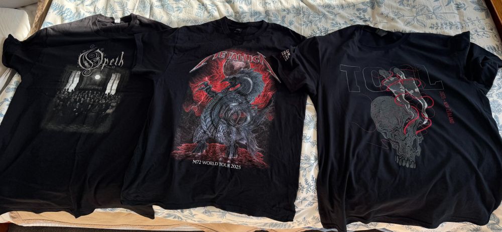 My merch haul from Gigpocalypse, featuring t-shirts from Opeth, Metallica, and Tool 