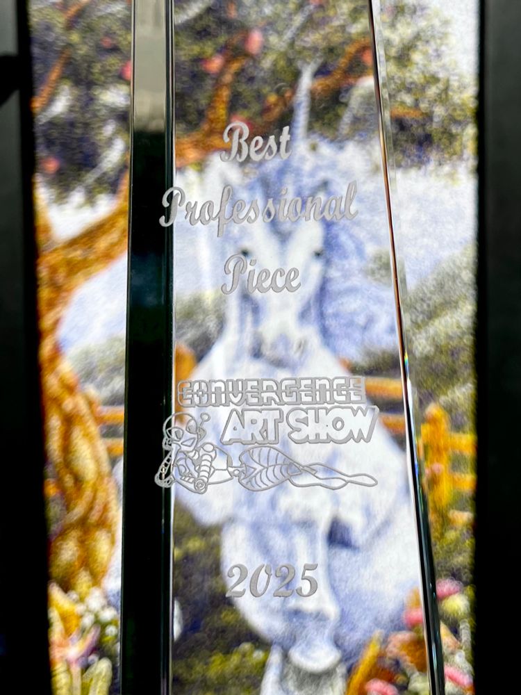 The CONvergence Art Show award for Best Professional Piece in front of my winning painting, a pointillism painting of a unicorn titled “The Unicorn Breaks Free”