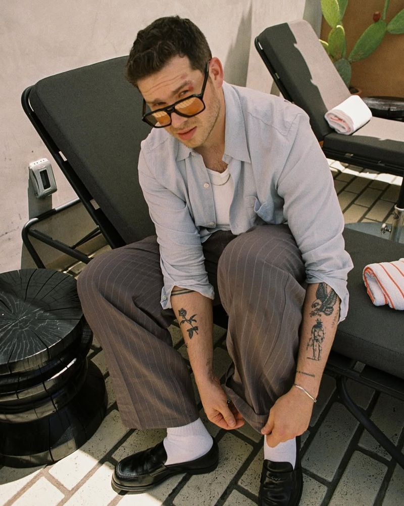 Oliver Stark photoshoot his in glasses and I can see his tattoos and I wanna fuck lick every tattoo he has and then I want him choke me out with those same tattooed arms until I can’t breathe I am who needs air anyway 