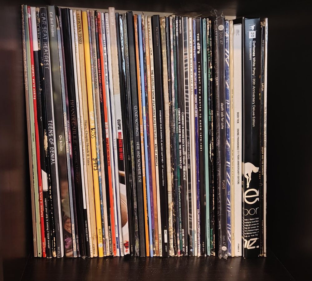 Shelf with many records standing up, spine out. Too many to write them all here but ones I think would likely be in the running are:

Carseat Headrest: Teens of Denial
Cloud Nothings: Here and Nowhere Else
Deftones: White Pony
Clipse: Hell Hath no Fury
The dBs: I Thought You Wanted to Know
Brandi Carlisle: By the Way I Forgive You
Cymbals Eat Guitars: Lose
Camp Trash: The Long Way the Slow Way
Captain We're Sinking: The Future is Cancelled
Death Cab for Cutie: We Have The Facts
Death Cab for Cutie: Plans
Elvis Costello: King of America