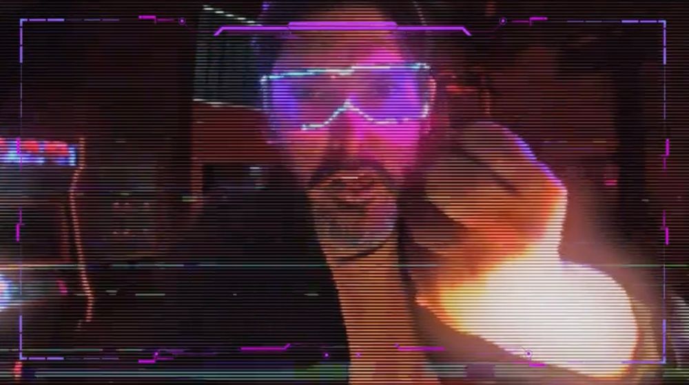It's a polymath Brazilian man with futuristic shades and a mighty raised fist 