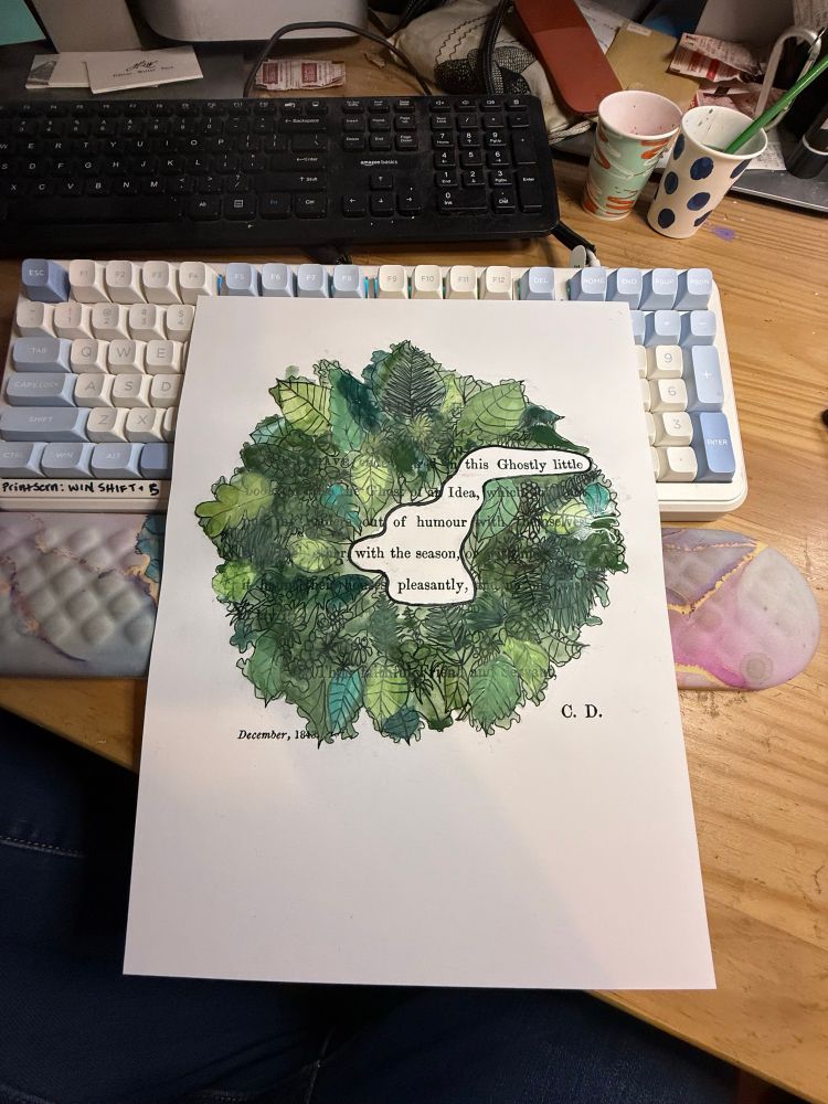 Keyboard with painted print of Christmas wreath and the text this ghostly idea of humor with the season pleasantly 