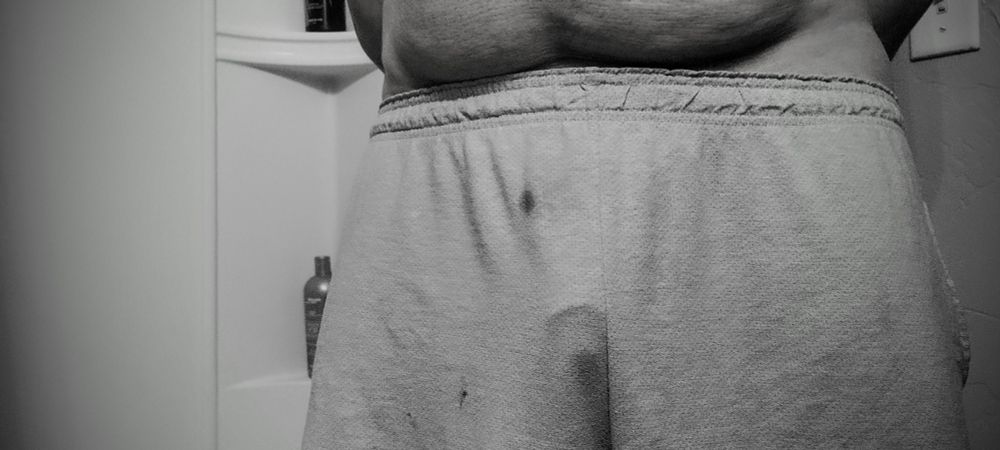 Myself in the bathroom with the camera looking at my crotch. I'm just wearing some grey shorts. The outline of my penis head is visible. 