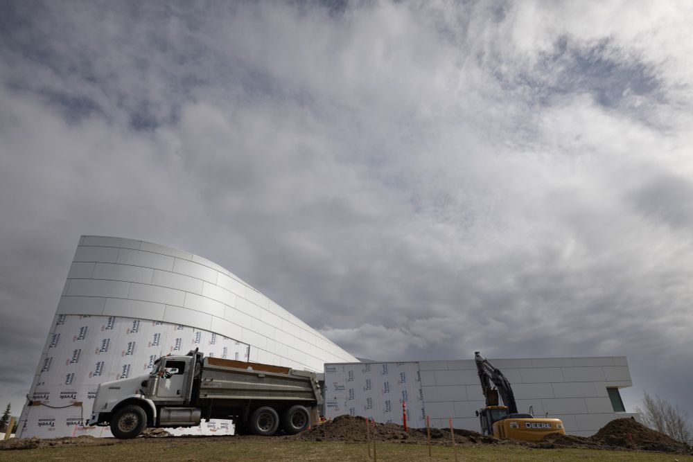 West side of UA Museum of the North with heavy equipment and exposed wall.