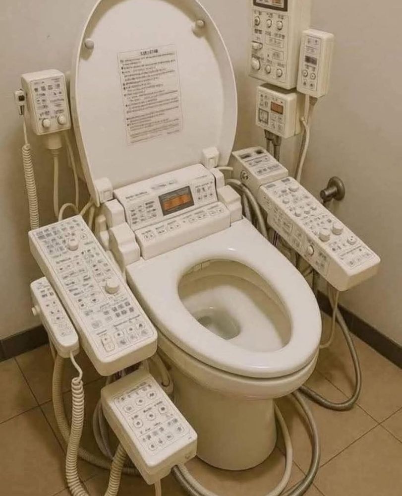 A bidet with so many control buttons, like from a spaceship.