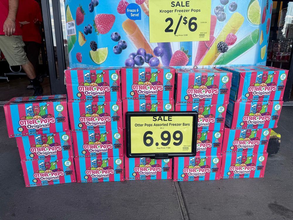 A big stack of otter pop boxes on sale for $6.99