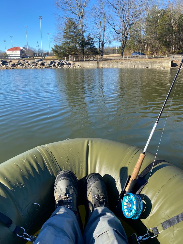 Man floating in raft fishing
