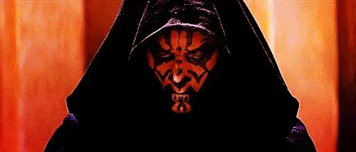 darth maul from star wars is wearing a hooded cloak