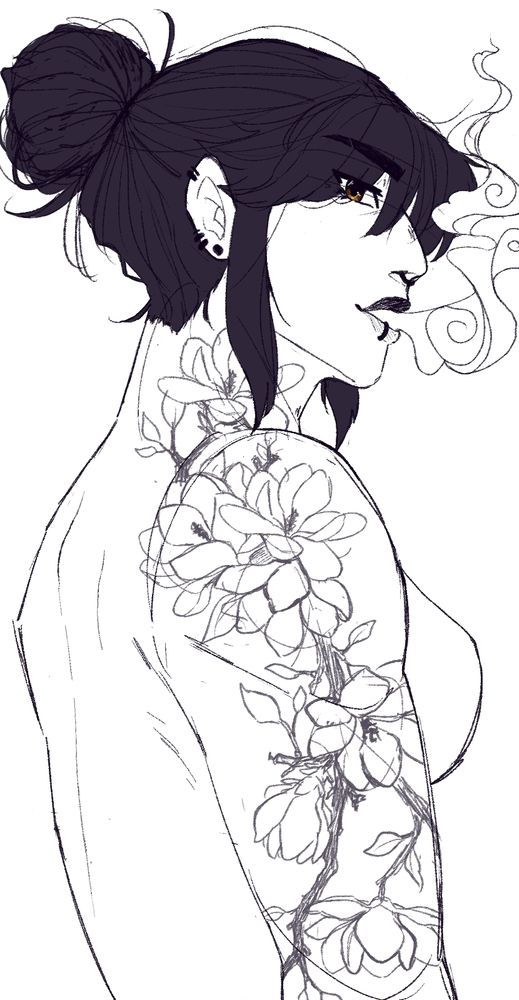 a shirtless woman with dark hair in a bun smoking with a focus on her left arm tattoo of magnolia flowers