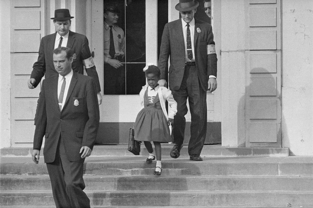 Ruby Bridges attending an all white school.
