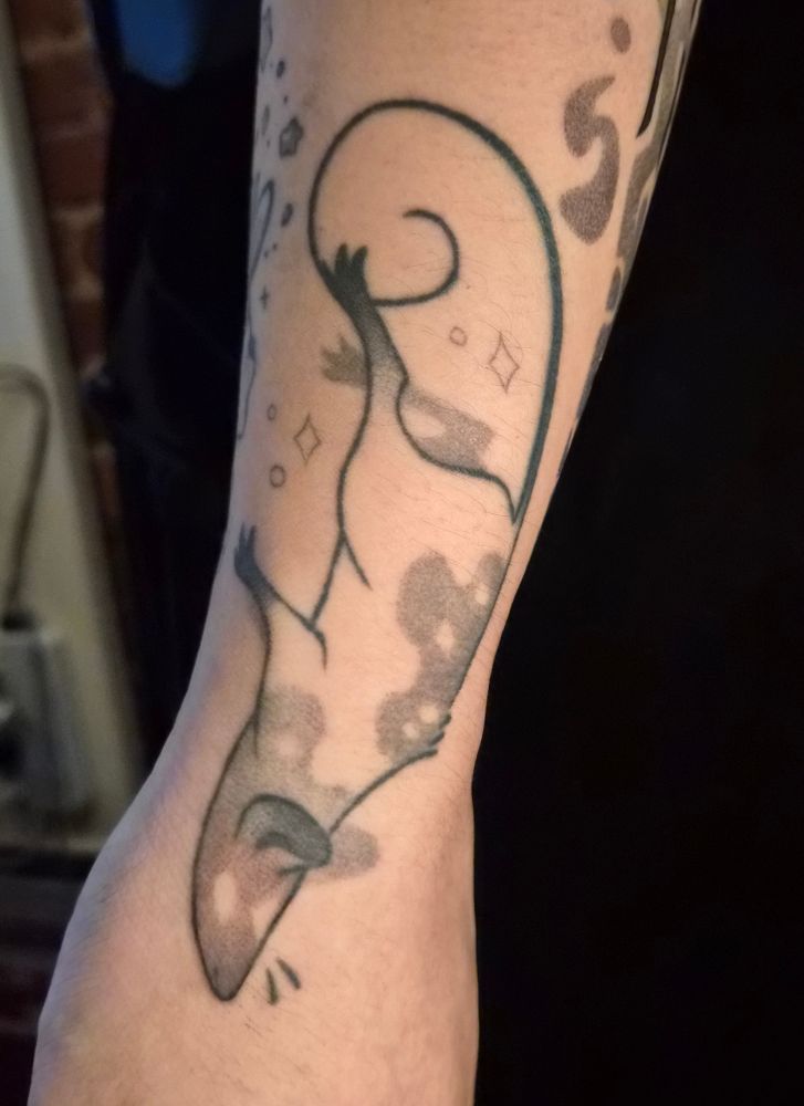 A tattoo of a little starry rat
