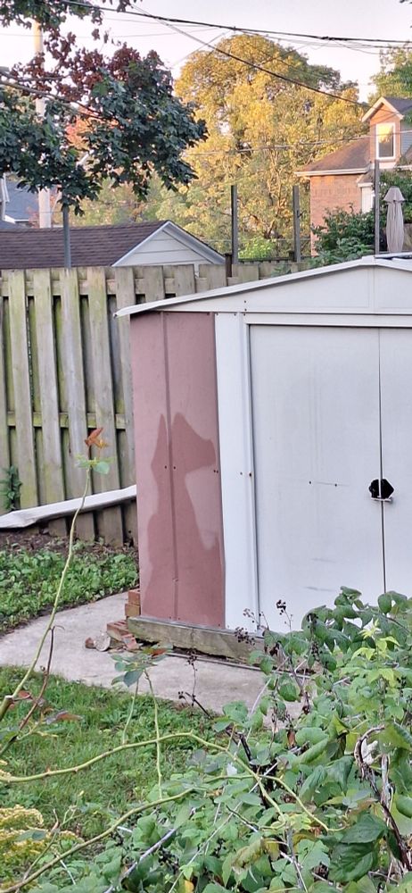 Metal shed with moisture on outer wall