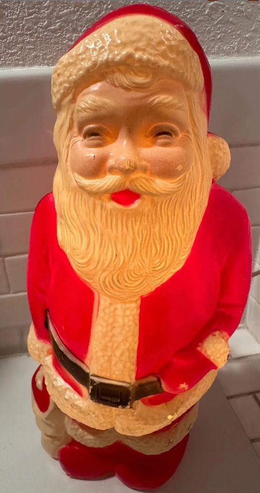  A vintage blow mold santa with some extremely squinty eyes 