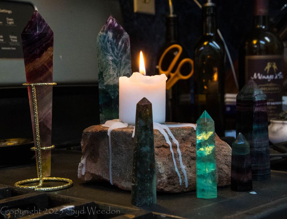 Crystals and candle on my stove top.