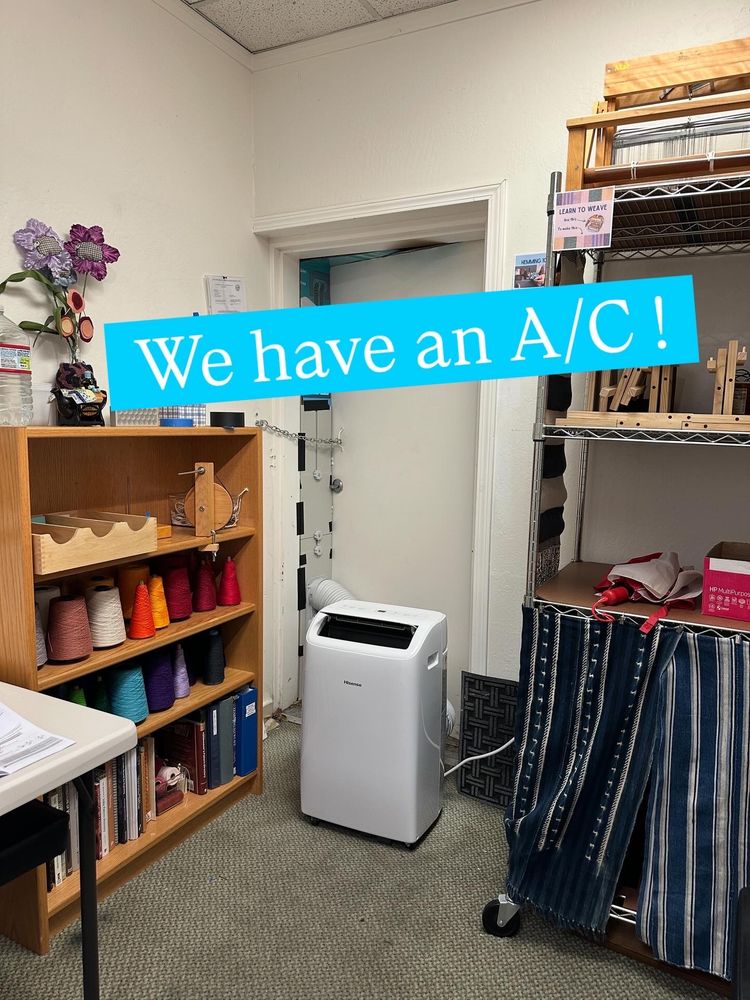A portable air conditioning unit set up in the Micro Fiber School.