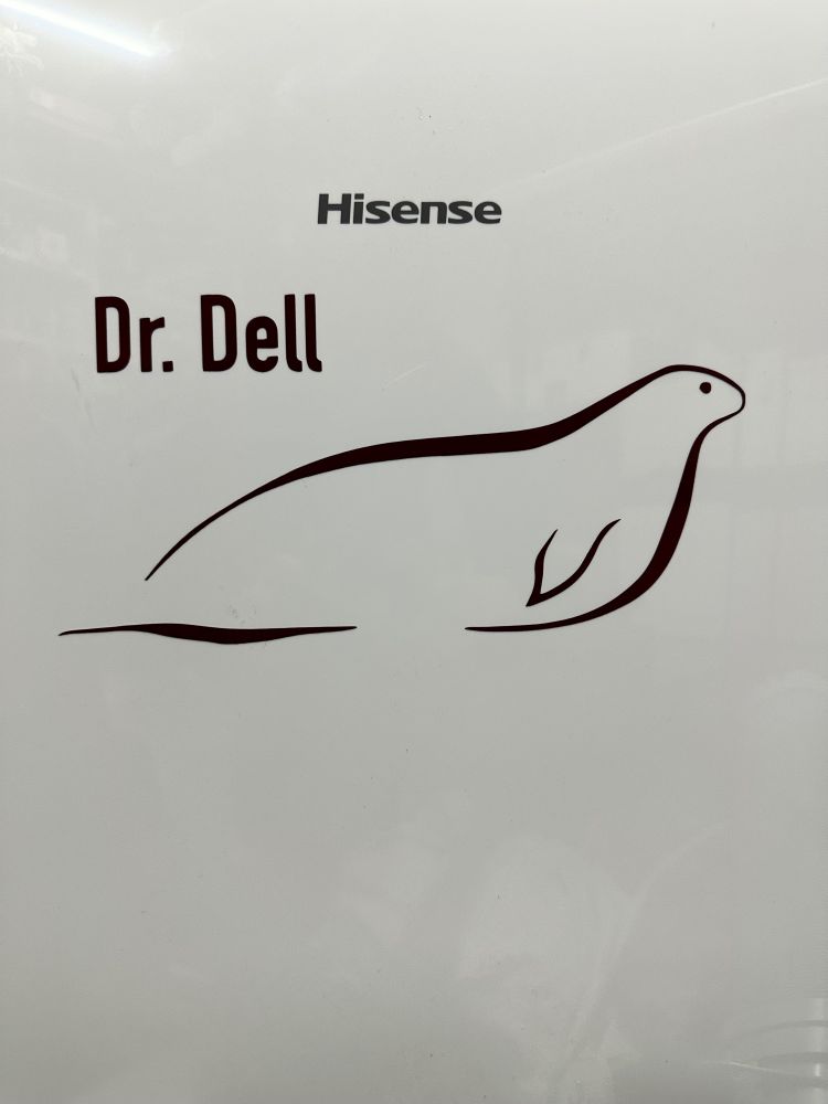 A vinyl sticker on the front of the air conditioning unit. It says Dr. Dell next to a seal logo that was shamelessly stolen from Weddell Seal Science lab.