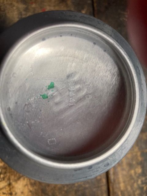 Bottom of one of the cans holding what seems to be the wrong type of Dr Pepper.