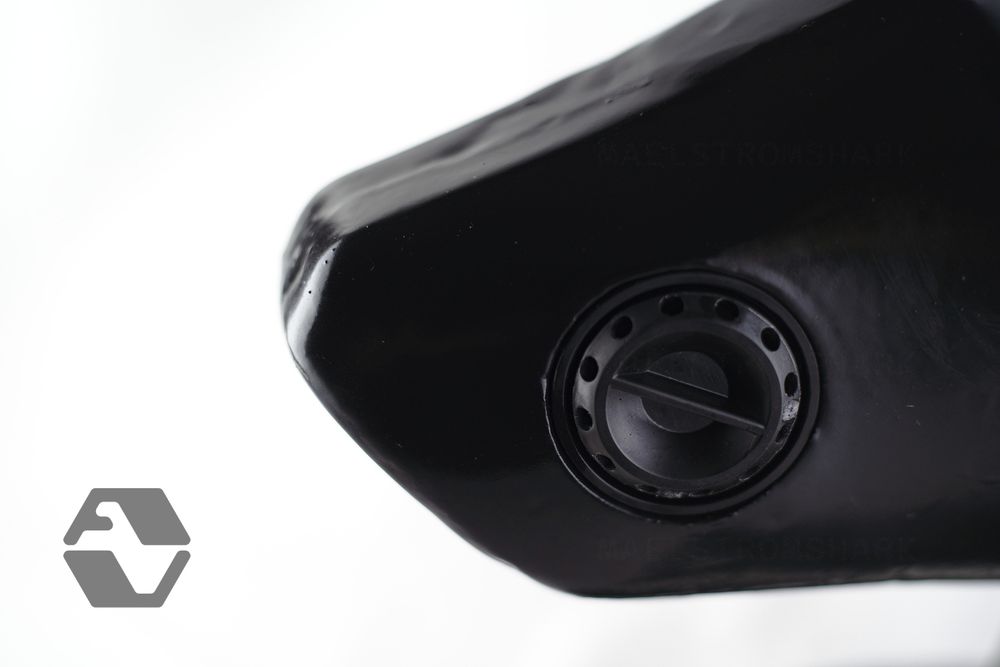 Detail view of J9 latex hood snout, showing the cover installed in a 40mm filter port and the angular profile in stark contrast to the white background.