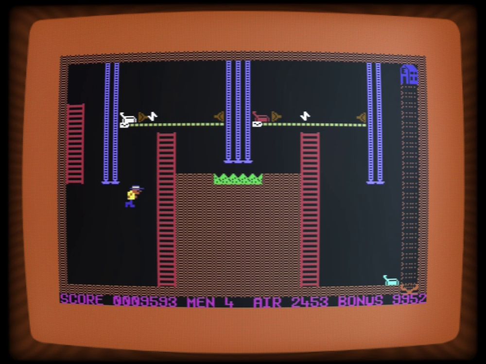 "Big Mac: The Mad Maintenance Man" on the C64, being played in the C64emu emulator by Daemon Pig Productions.  The second level.  If you're quick you can get in under those stompers right away to get at the other ladder. 