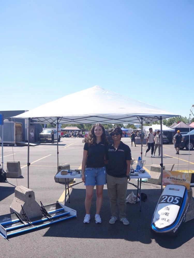 U of T Engineering student team showcasing Formula racing car components at the Indy Toronto event in Thunder Alley.