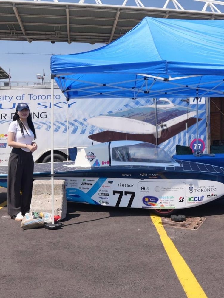 Student team showcasing Blue Sky Solar vehicle