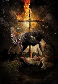 A strange creature with a pointed skull evoking a Klan hood.  It has six red eyes arranged in a row, followed by an open maw with huge white, pointed teeth.  It looks a lot like something you'd see in Resident Evil or maybe Silent Hill.  It is crouched in front of a burning cross with several people-shapes in Klan robes sort of blurry in the background