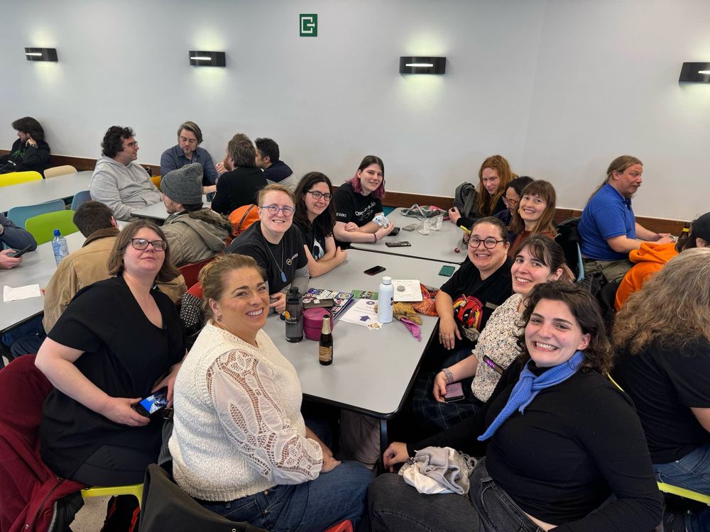 women of open source sitting around a table at FOSDEM 