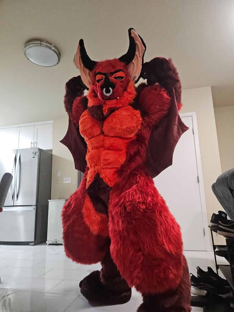 Low angle picture of me in my fursuit flexing 