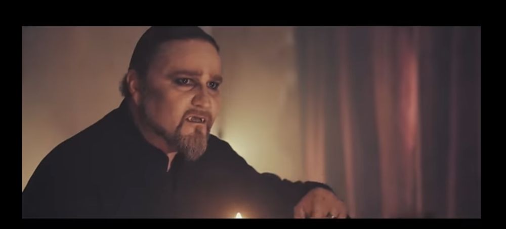 Screenshot from the music video to “Killers with the Cross,” it’s Attila Dorn dressed like a vampire