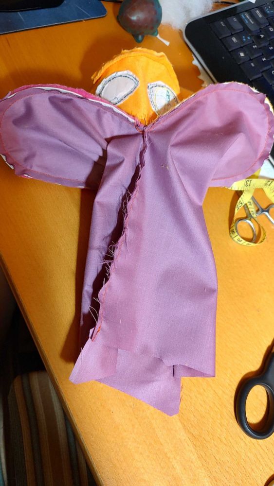 Here's a pic of the inner lining of Jormungandr turned inside out. The geometry of his body was challenging to tackle, because the inner lining has to allow for your hand to stick into and has to connect to certain parts of the exterior. It also must allow stuffing to pass through in certain areas, all while keeping in mind that the factory must be able to manufacture the puppet in a logical manner. It felt like I was making two plushies at the same time which were ouroboros'ed inside each other. 