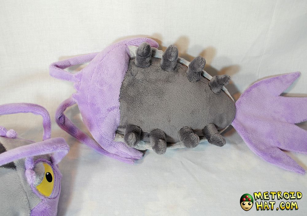A wimpod plushie turned belly-up to show its eight little feetsies. No matter how much it wiggles them, it is incapable of escaping