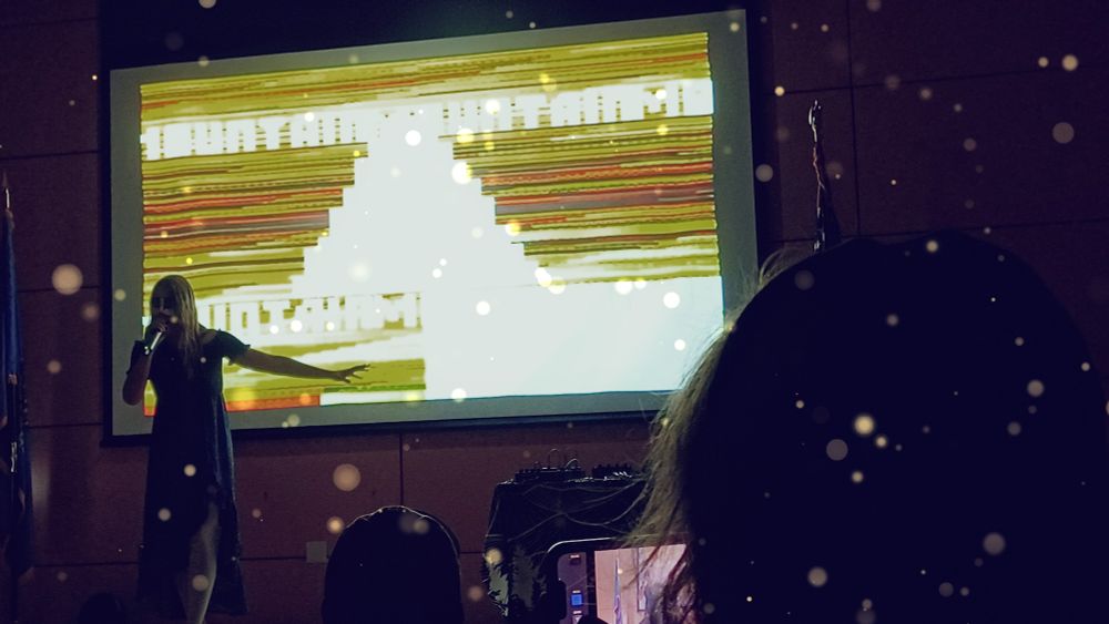 No Moore performing at Library Out Loud (ooops my phone had a filter but looks cool)