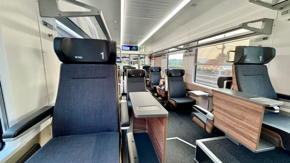 The first class interior of BLS RABe 528 MIKA 528 123 looking from the end of the coach where the 1+1 'throne' seats are, on the raised section over the bogie / wheels.