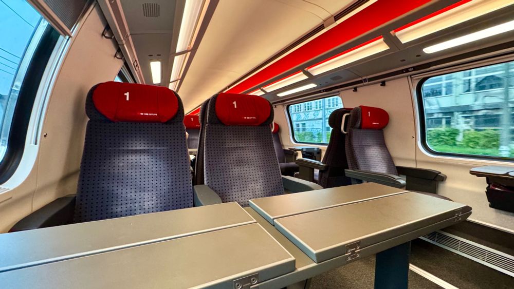 The first class interior of the double deck SBB IC2020 coaches on the upper deck, with the seats in a 2+1 layout.