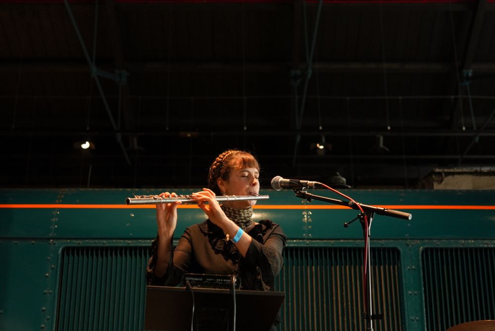 Photo of Rhiannon playing the flute during her performance.
Photo by Arya Kokate