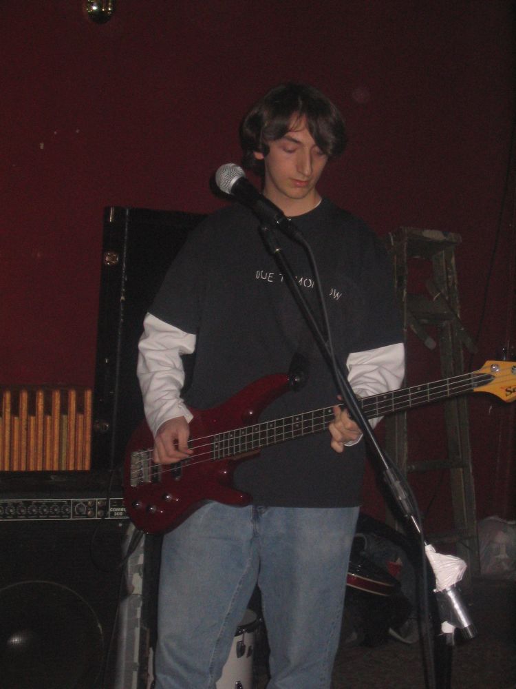 Connor McClure, of the band Tuffy, playing bass at a concert in 2005