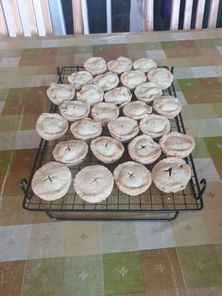 A batch of mince pies, fresh out of the oven.